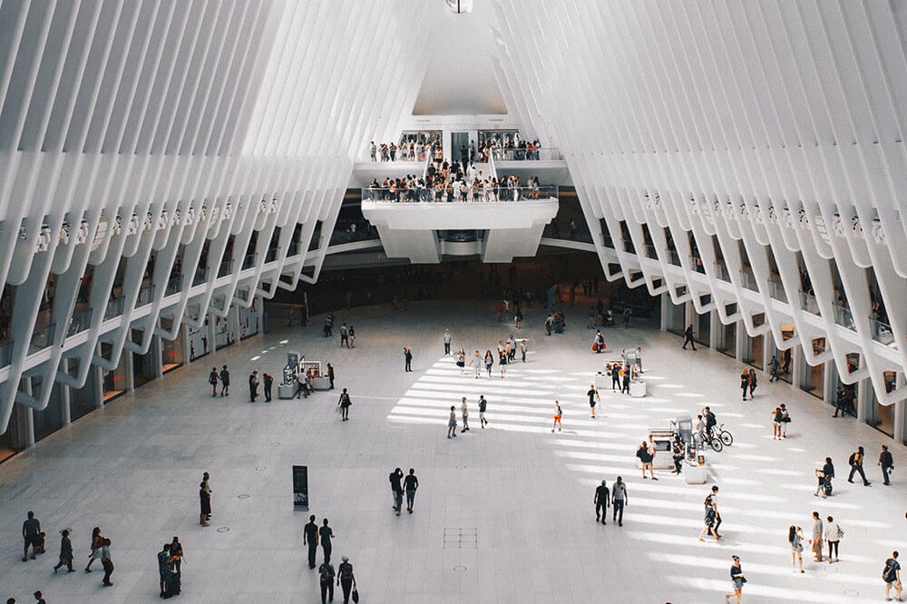 Interior of a mall that is white with people