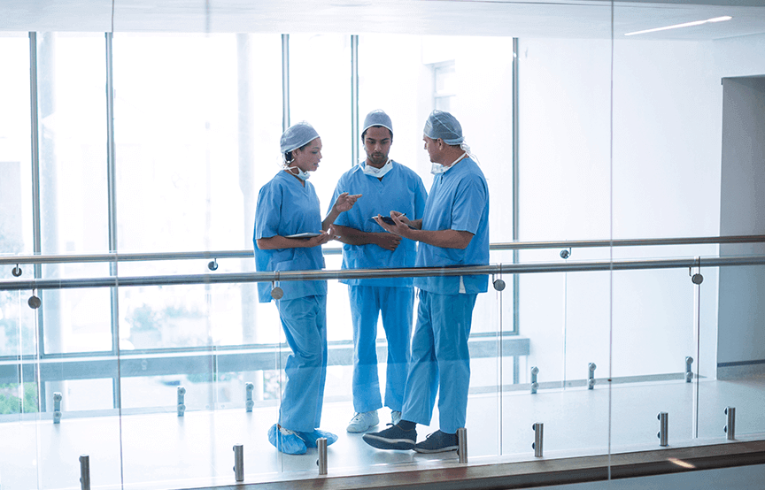 health professionals standing around discussing 