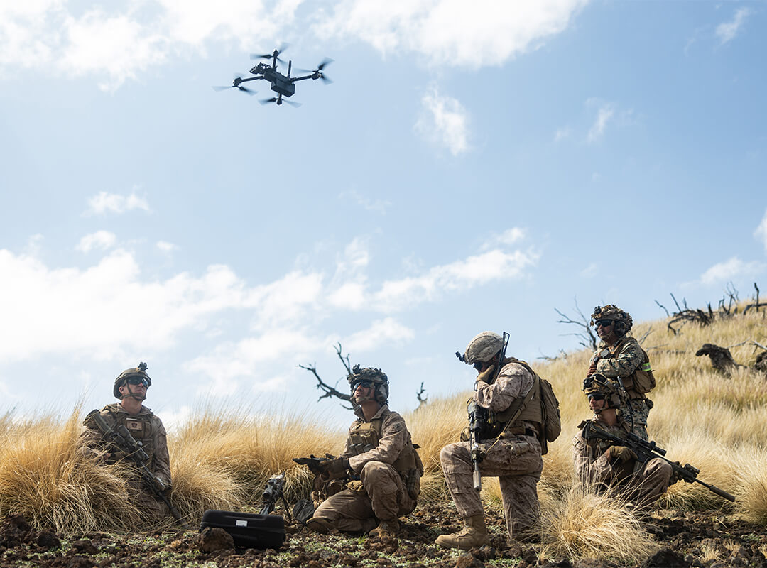 soldiers looking at drones