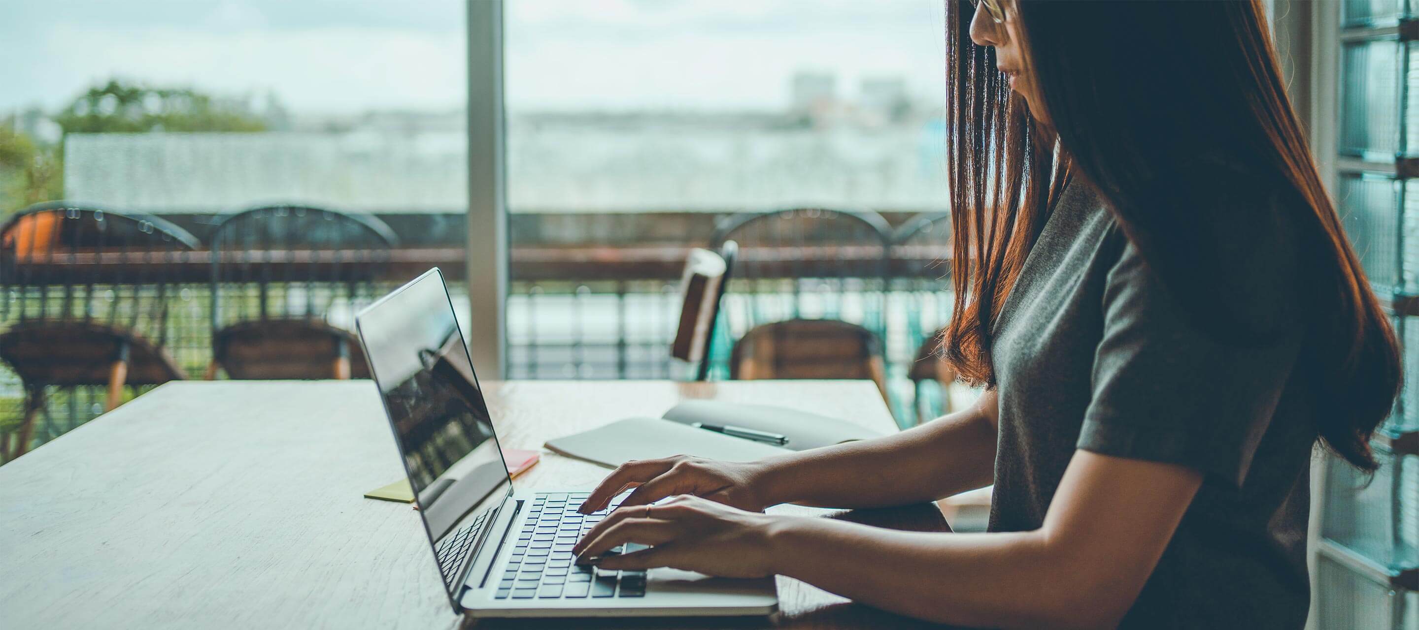 female student working on laptop