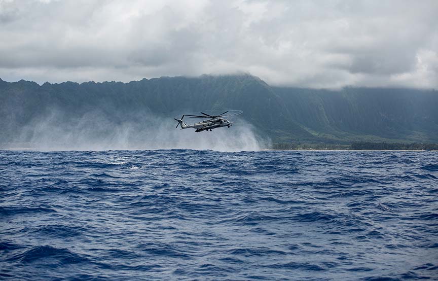 helicopter flying over water