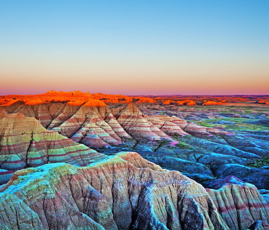 Mountains with a sun set in the background and clear sky