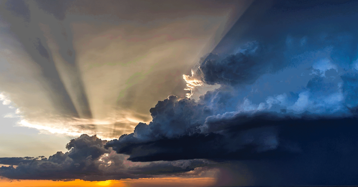 image shows clouds and sunset in sky