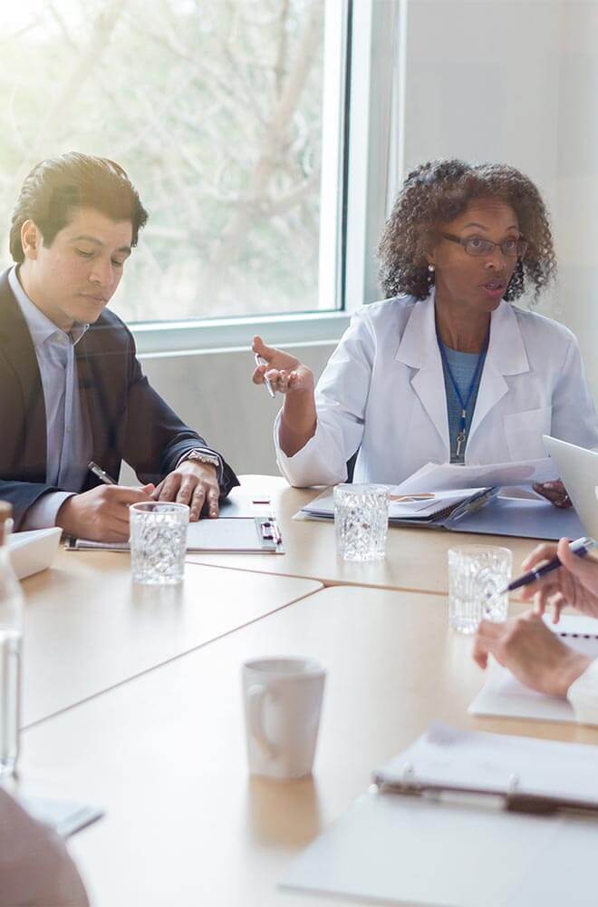 doctor and business man at the meeting table