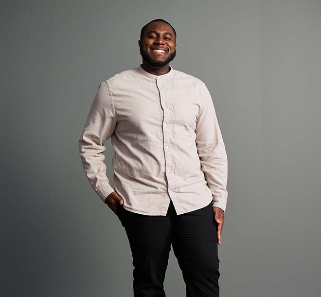 man standing and smiling