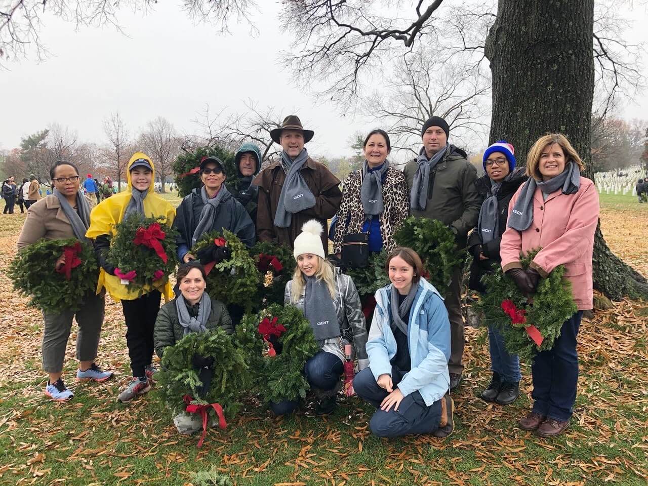 Group of people holding wreaths during Wreaths Across America event