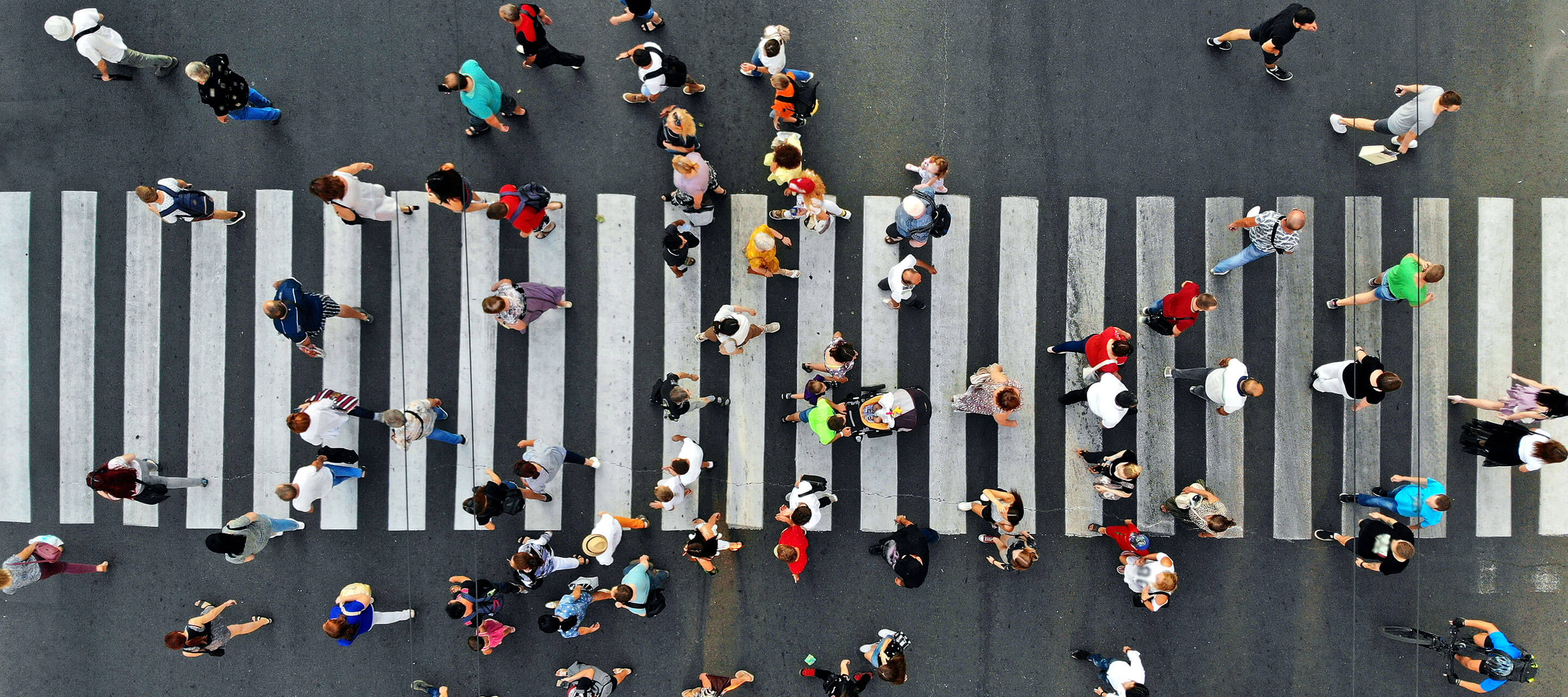 aerial view of pedestrians walking across the street