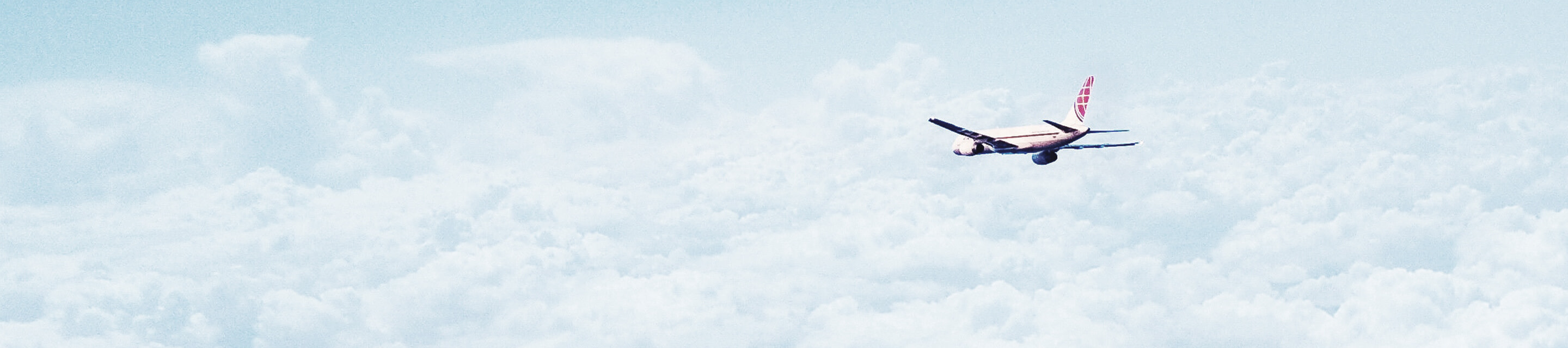 Plane flying over clouds in the sky