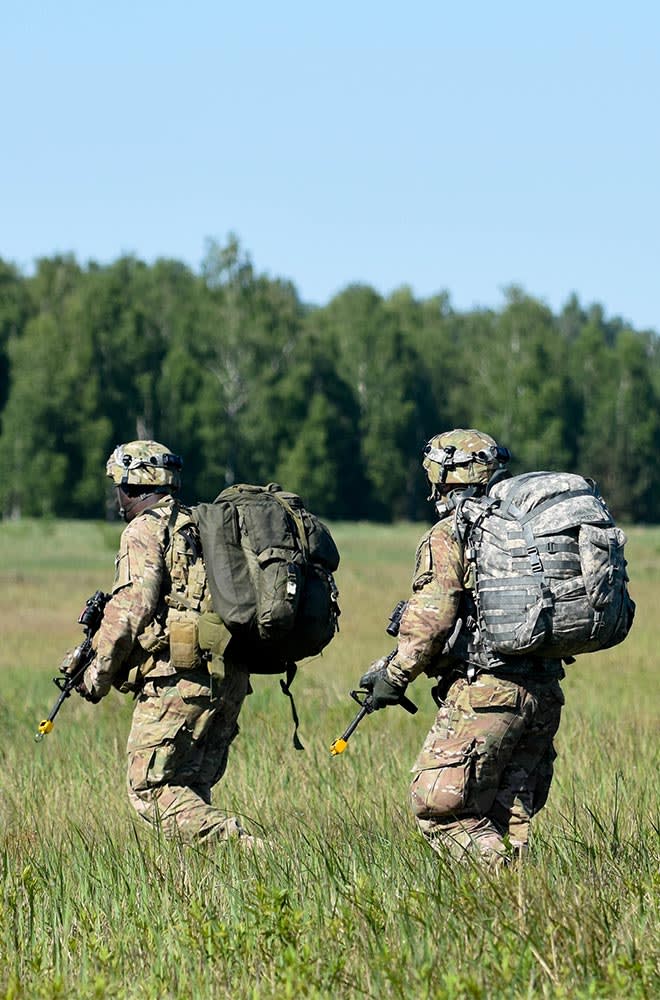 soldiers walking in field