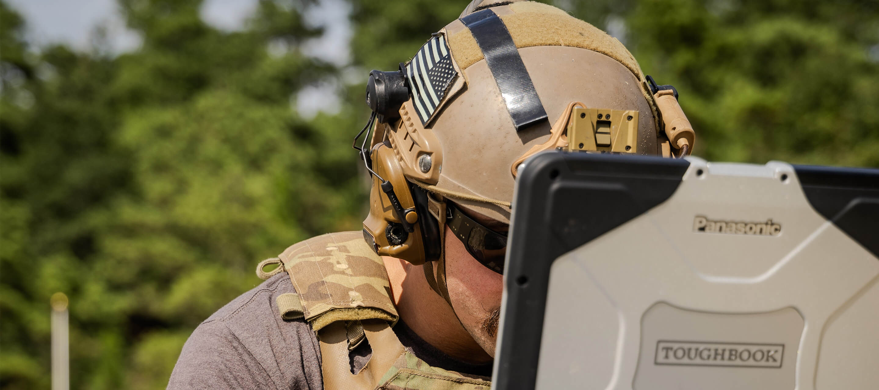 soldier looking at his laptop