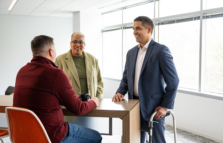 GDIT employees having a conversation