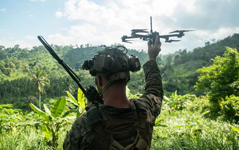 soldier holding drone