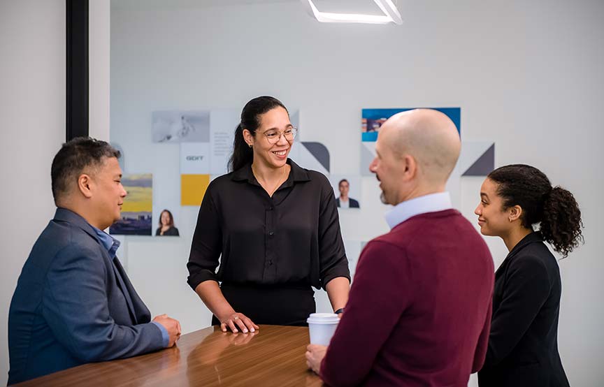 Coworkers smiling together in the office