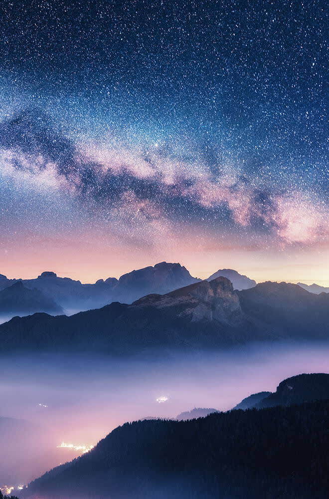 Mountains and sky with stars at dusk