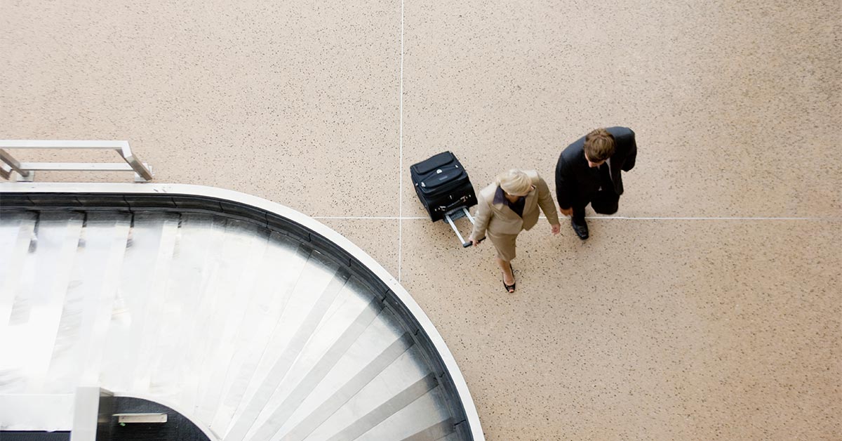 aerial view of two people walking through the airport