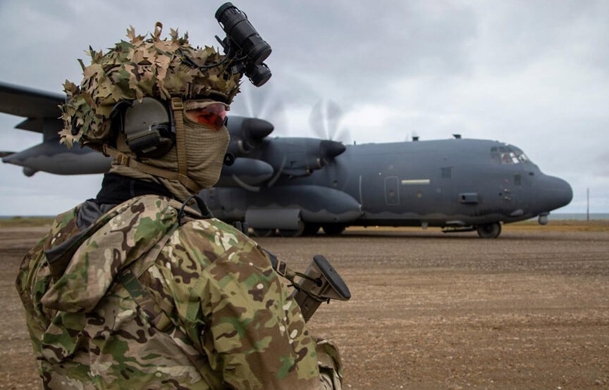 soldier looking out at plane