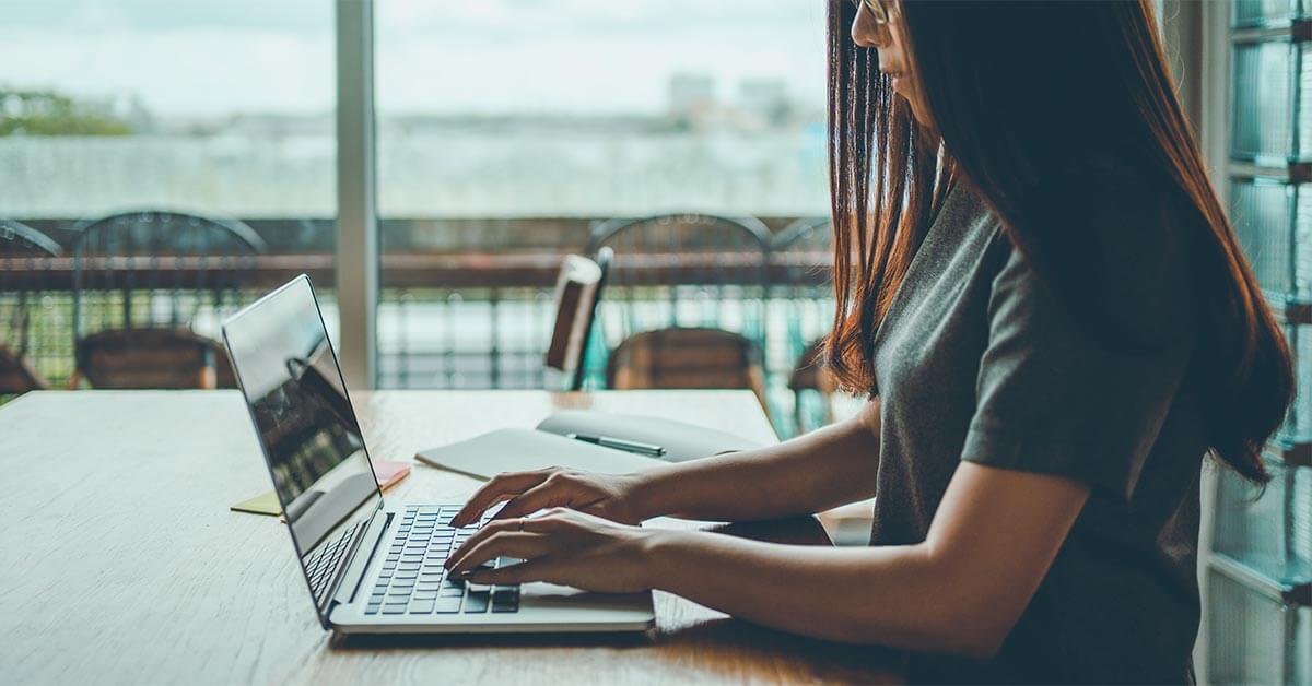 female student working on laptop