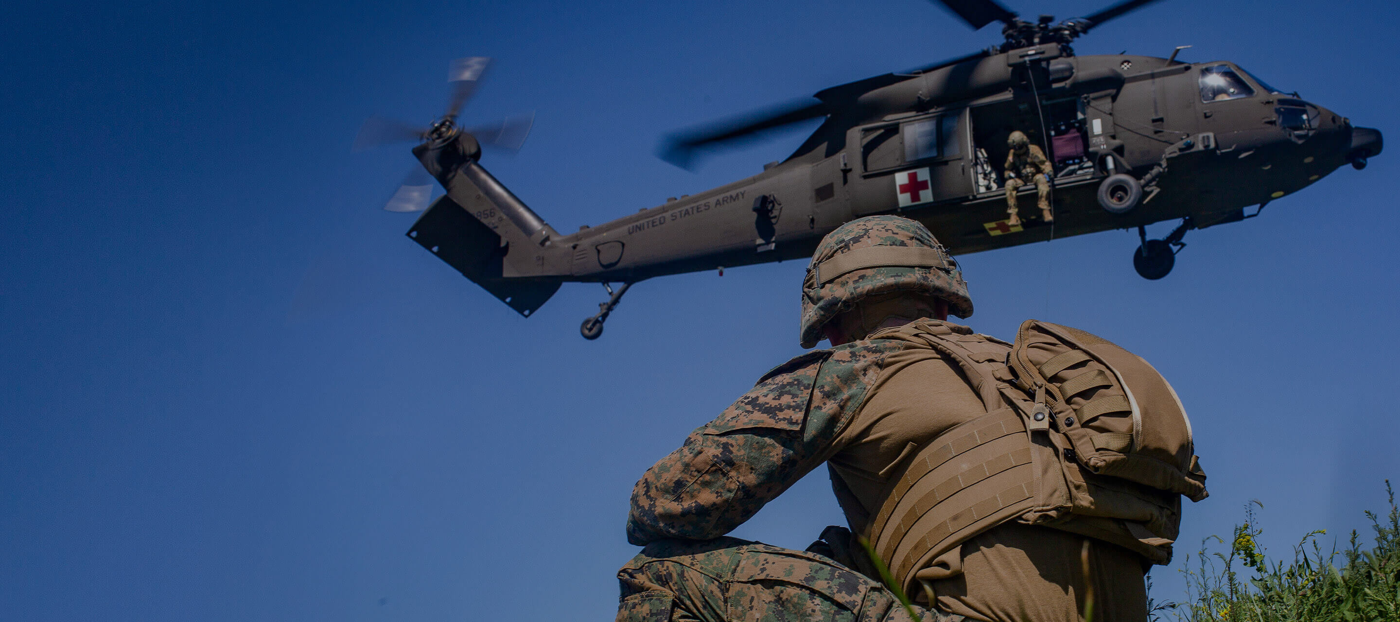 soldier looking at helicopter