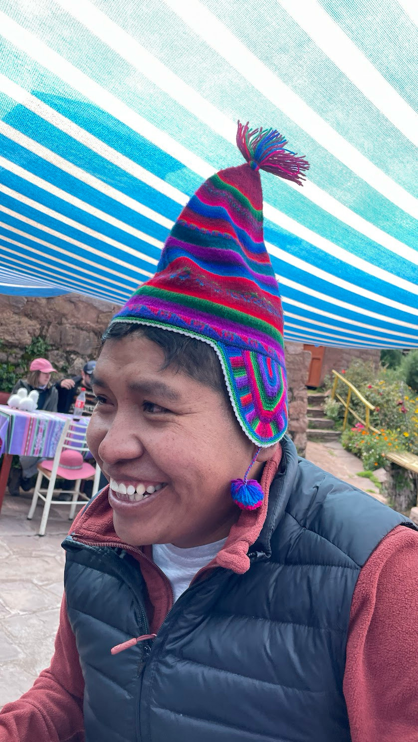 tquile guide and hat