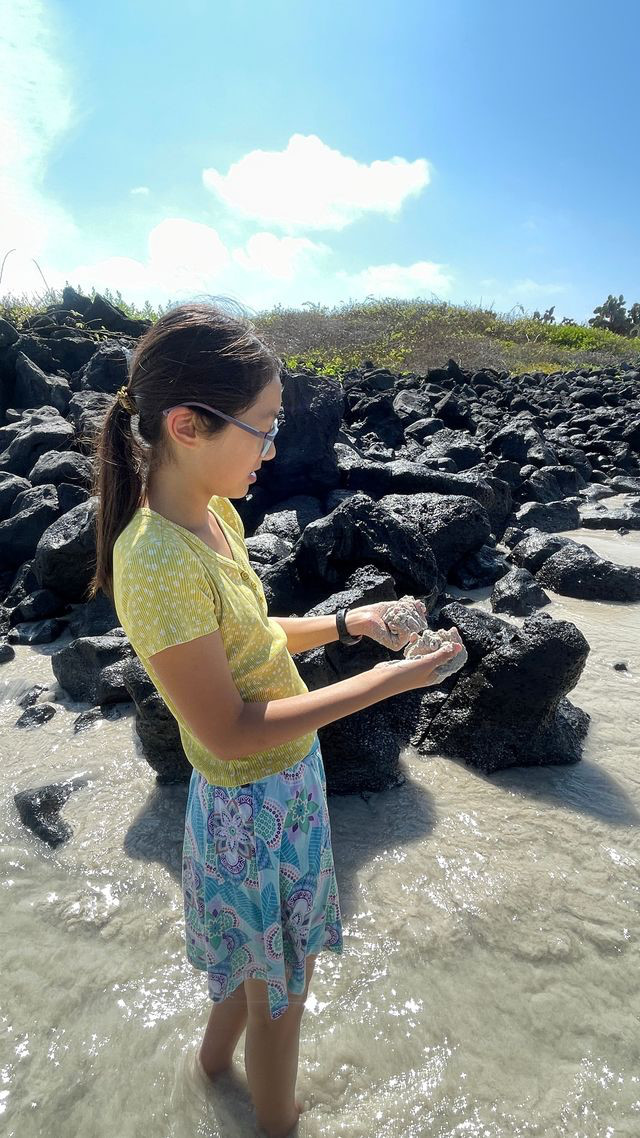 tortuga bay sand on hands