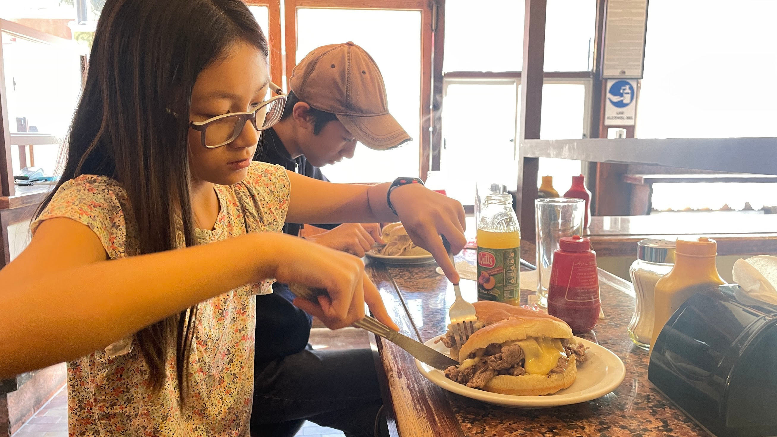 santiago cutting sandwich