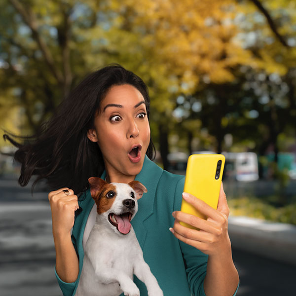 Girl who is excited and looking at her phone