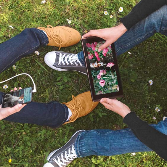 friends using their tablets
