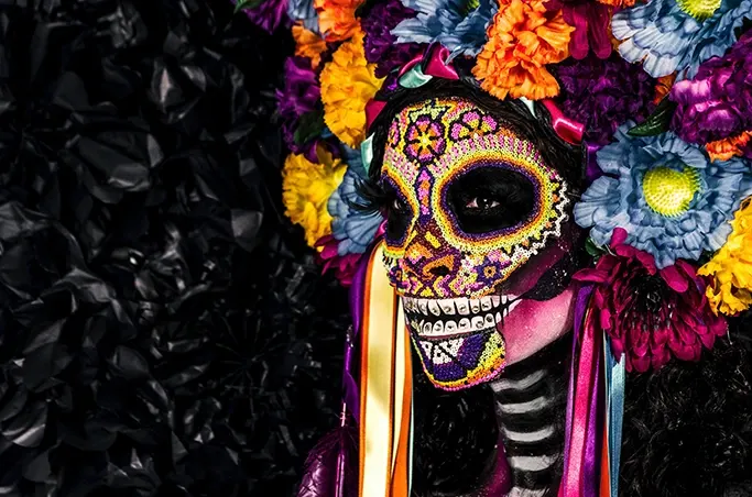 A colourful beaded and face-painted sugar skull