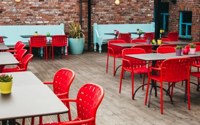 Colourful seating on an outside roof terrace at Las Iguanas York