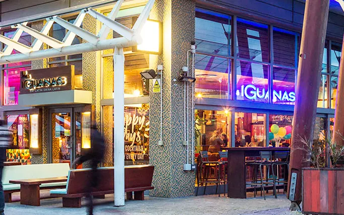 Neon-lit exterior of Las Iguanas Bristol Harbourside