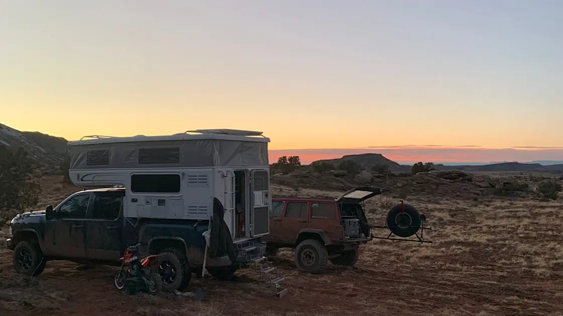 RVshare staff photo of a camper and Jeep at sunset in Salt Lake City, Utah