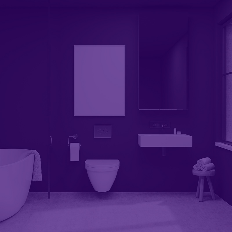 Mörkt minimalistiskt badrum med vitt fristående badkar, väggtoalett, handfat och spegel.