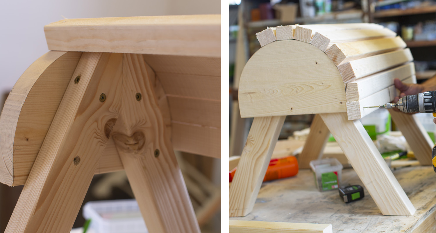 Ljus träpall med halvcylindriskt ribblock, A-formade ben och borrmaskin i verkstad