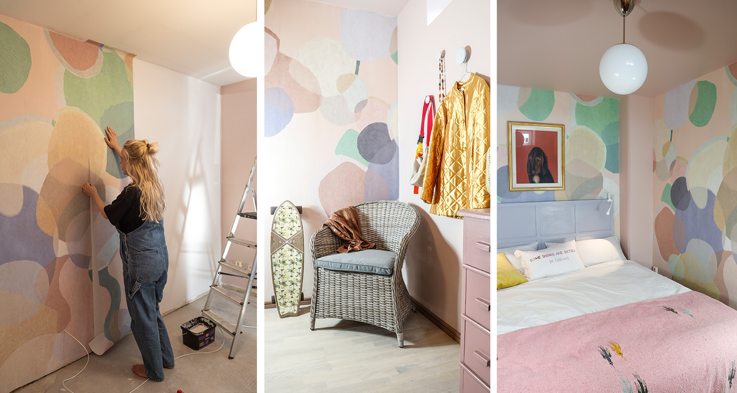 Sovrum med pastellcirkelmönstrad tapet, rottingfåtölj, gul jacka på krok och rosa pläd.