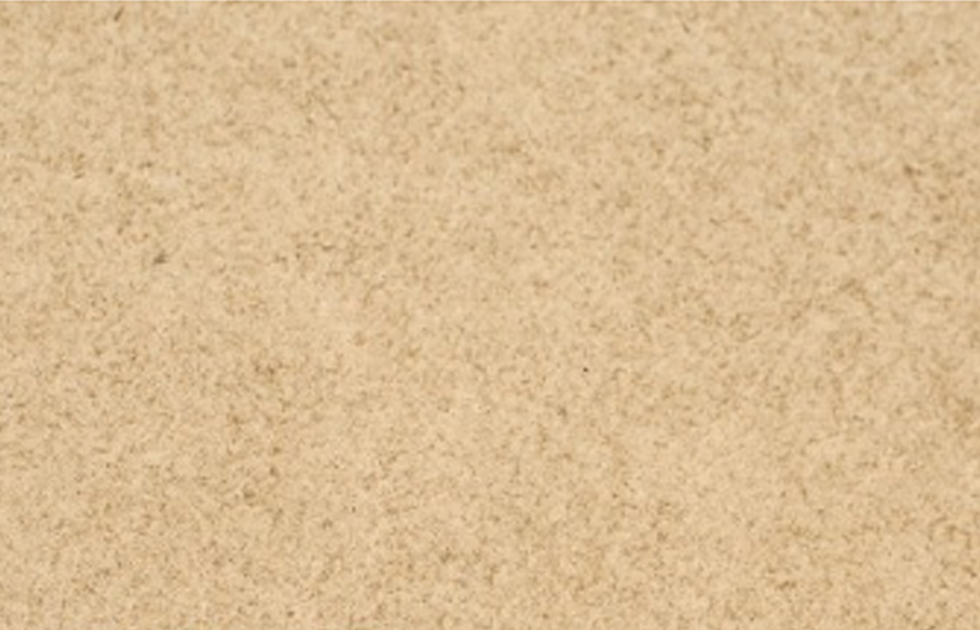 Närbild av finkornig beige sandyta med jämn textur