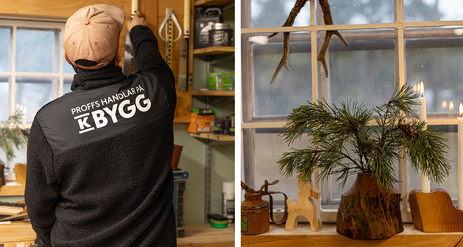 Arbetare i svart jacka med “Proffs handlar på K-Bygg” och keps, fönster med granris och ljus.