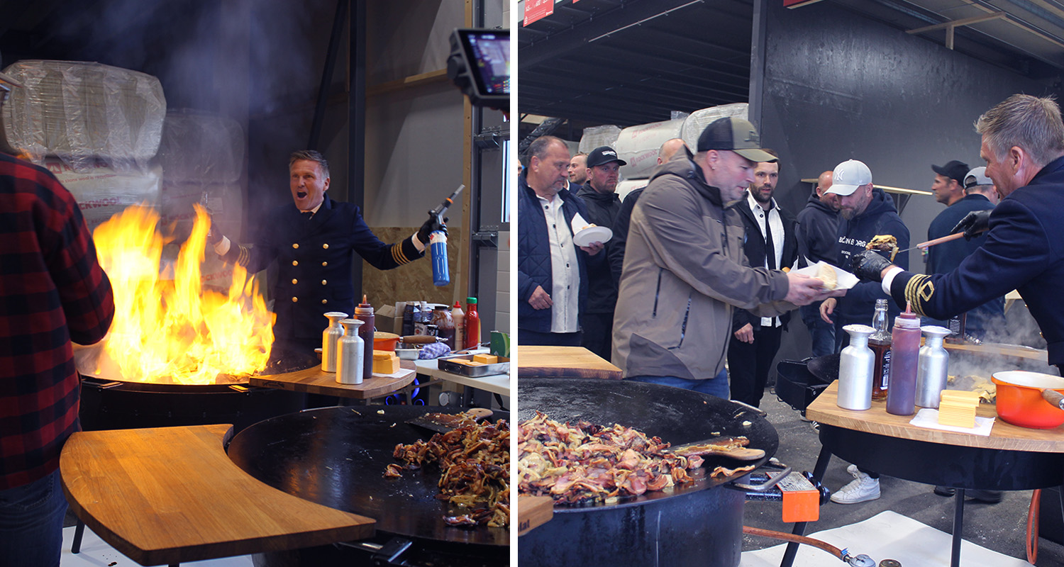 Inomhusmatstånd med stor orange låga, grillpanna fylld med stekt bacon, gäster i kö.