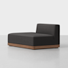 A modern armless sectional sofa with a dark charcoal cushion and a low wooden base, placed on a light-colored floor against a plain white background.