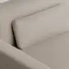 Close-up of a beige textured fabric sofa with a rectangular matching cushion placed against the backrest.