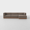 A modern brown sectional sofa with wooden base, featuring three seats and a right-side chaise lounge, set against a plain white background.