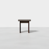 A small, dark wooden side table with a simple, minimalist design and square top, standing on three straight legs against a plain white background.