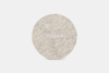 A round, light gray felt pad with the word THUMA written in white, centered on a plain white background.