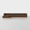 A modern sectional sofa with brown upholstery and a light wooden base, featuring a left-facing chaise and clean, minimalist design, set in a bright room with a white floor and background.