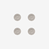 Four round, silver metal tokens arranged in a square pattern on a white background, each engraved with the word THUMA around the edge.