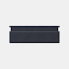 A rectangular, dark-colored desk accessory with a soft, textured surface, likely a wrist rest or cushion, photographed against a plain white background.
