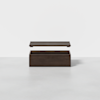 A dark wooden rectangular box with its lid slightly raised above the base, shown against a plain white background.