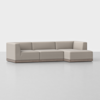 A modern beige sectional sofa with clean lines, low backrests, and a wooden base, arranged in an L-shape on a smooth, light-colored floor against a plain white background.