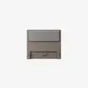 A modern wooden headboard with a gray cushioned panel attached near the top, set against a plain white background.