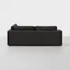 A modern, dark gray sectional sofa viewed from the back, set against a plain white background. The sofa has clean lines and thick cushions, with no visible legs.