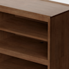 Close-up view of a wooden shelving unit with three shelves, showing a smooth, medium-brown finish and clean, modern lines. The shelves are empty and the background is plain.